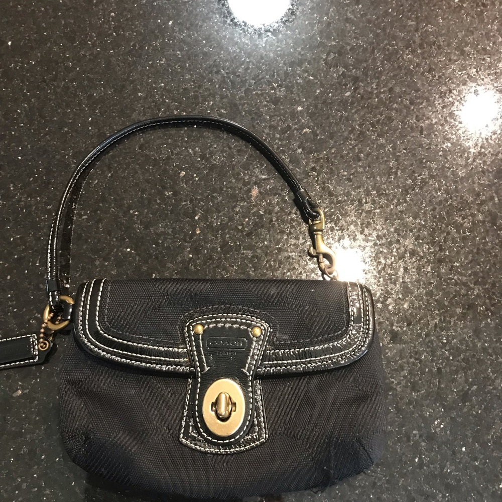 A Coach Black wristlet